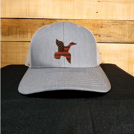 american flag duck shaped leather patch on a gray hat