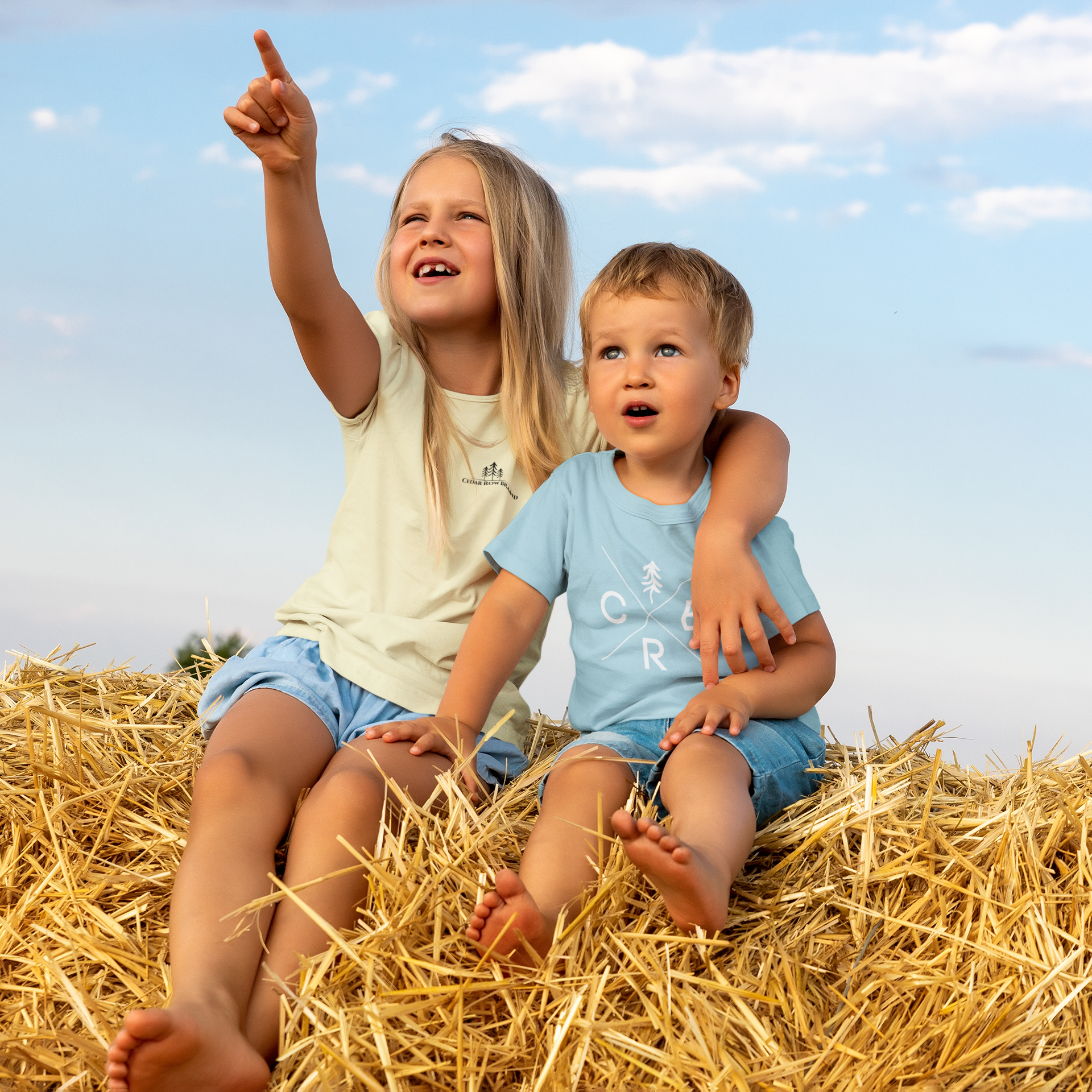 kids on a haybale wearing southern inspired tshirts
